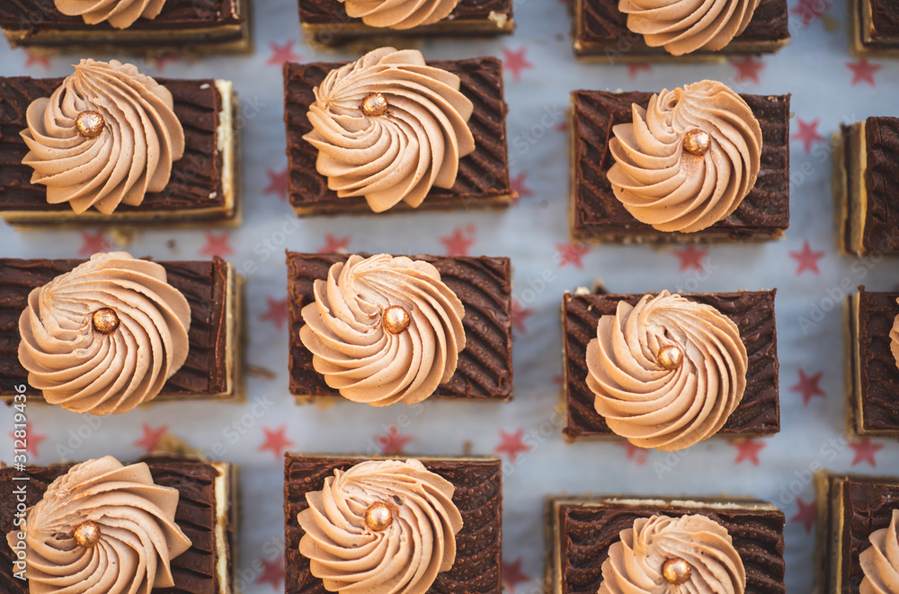 Fototapeta premium Delicious Chocolate square baked cupcakes, Top View
