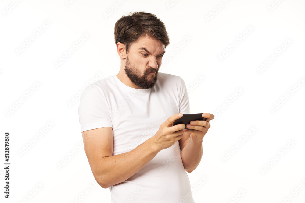 young man texting on mobile phone young man texting on mobile phone