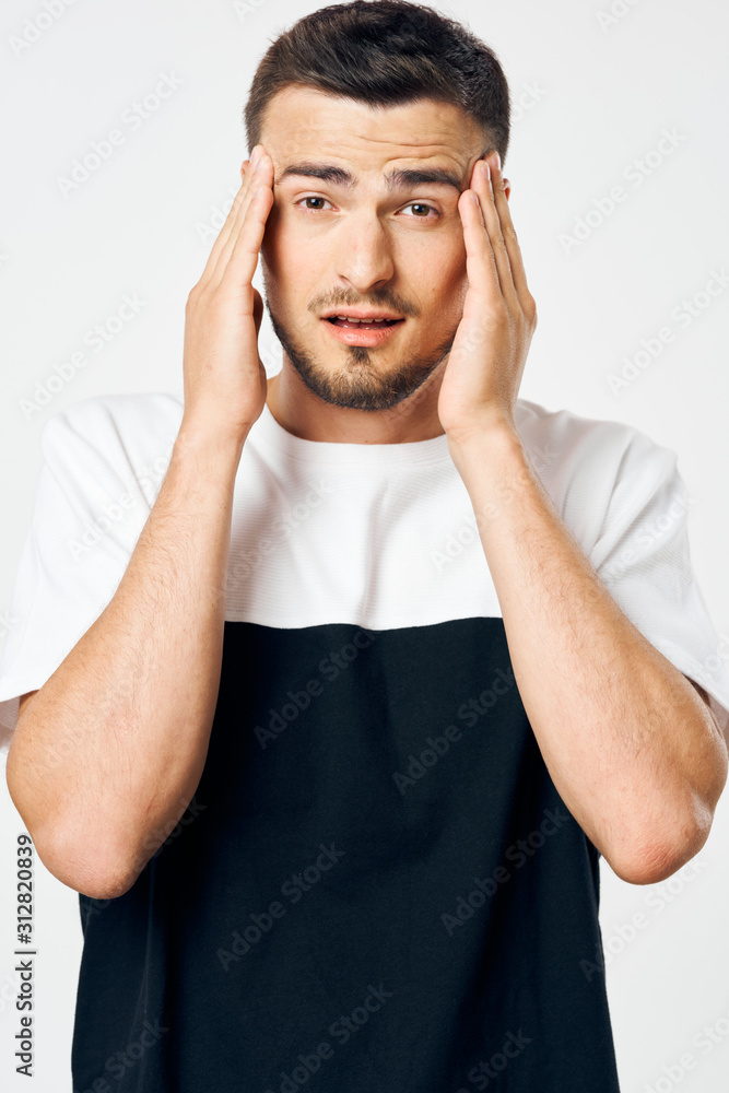 Fototapeta premium portrait of a man with hands on his head