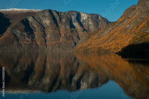 steep mountains at the Naeroyfjord in Norway in beautiful fall colors photo