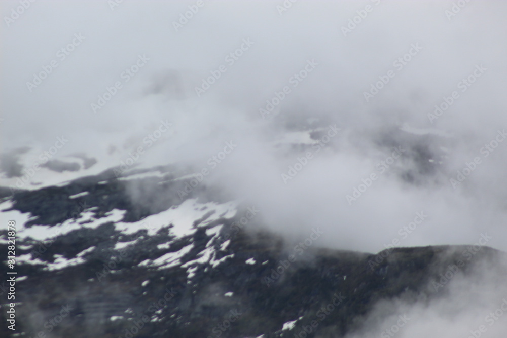 snowy foggy mountains