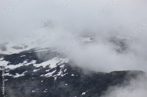 snowy foggy mountains