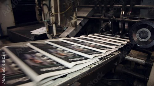 newspaper being printed offset printing press