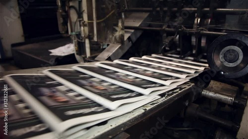 newspaper being printed offset printing press photo