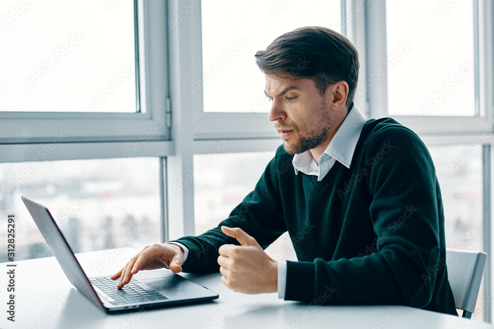 businessman working on laptop in office businessman working on laptop in office