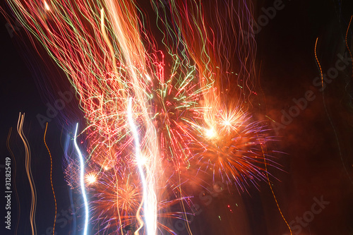 Night shot of beautiful abstract fireworks in festive New Years Eve celebration