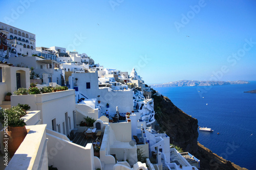 View of the white houses of Thira, the capital of Santorini, the sea and the volcanic caldera