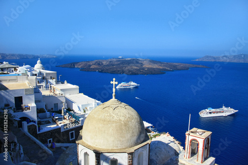 Thira, capital of Santorini, view of the church, caldera and the city situated on the cliff