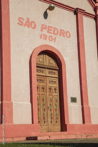 Decorated wood door on the facade of Chapel