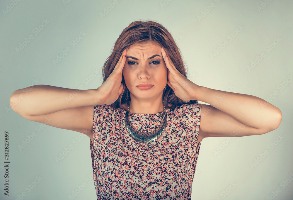 Woman hands on head having headache or stress Woman hands on head having headache or stress