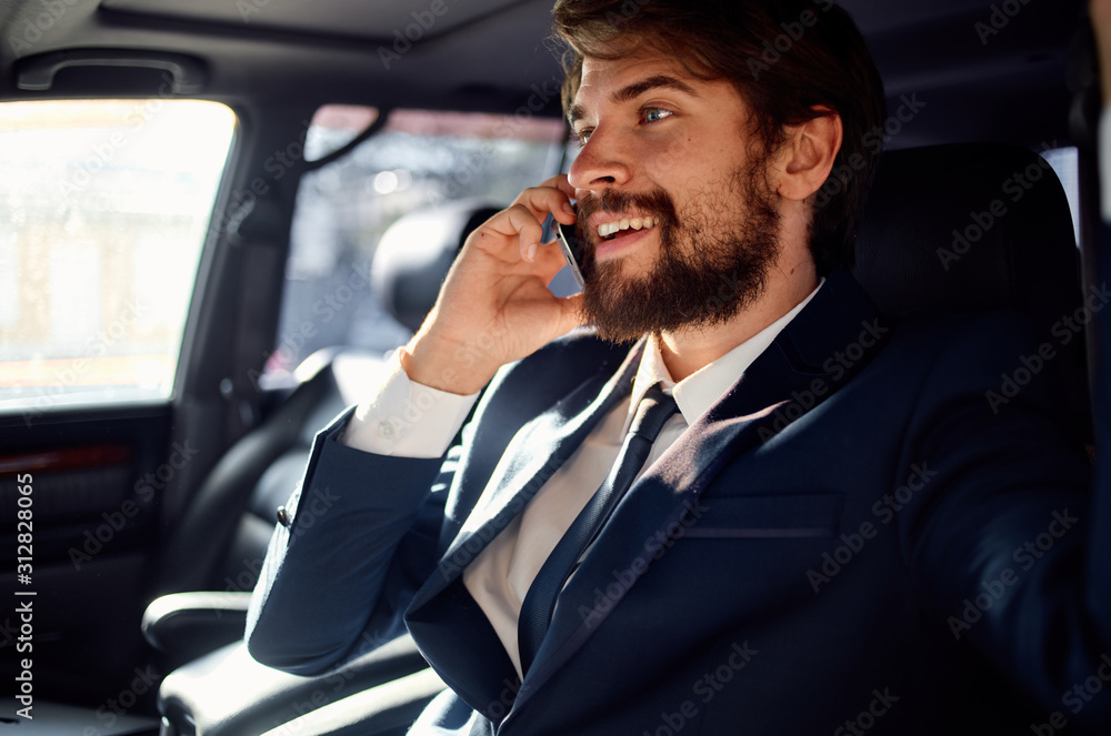 businessman talking on phone in car businessman talking on phone in car