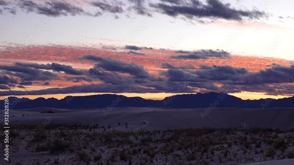 Stormy clouds in the evening at sunset in Sand Dune at White Sands National Monument. New Mexico, USA Stormy clouds in the evening at sunset in Sand Dune at White Sands National Monument. New Mexico, USA