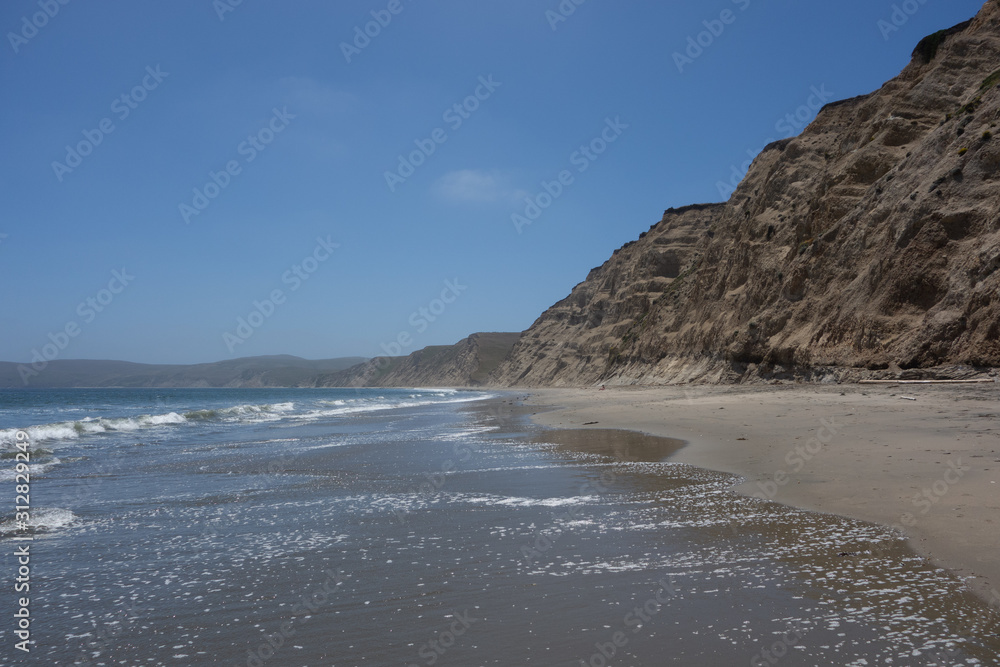 View looking down the scenic, remote Drakes Beach in the Point Reyes National Seashore View looking down the scenic, remote Drakes Beach in the Point Reyes National Seashore
