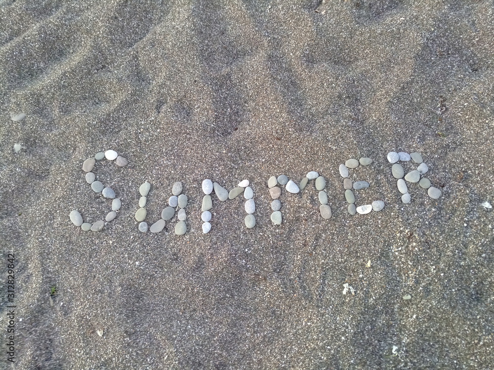 Fototapeta premium summer inscription in the sand