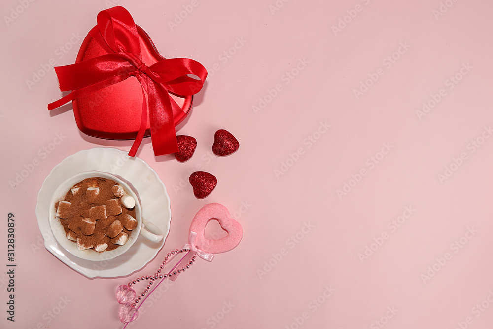 Greeting card for Valentine's Day or Women's Day with a cup of cocoa with marshmallows. Red hearts and gift box on a pink background, top view. Holiday greetings, modern woman concept Greeting card for Valentine's Day or Women's Day with a cup of cocoa with marshmallows. Red hearts and gift box on a pink background, top view. Holiday greetings, modern woman concept