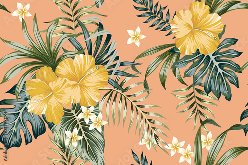 Tropical vintage yellow hibiscus flower, palm leaves floral seamless pattern peach background. Exotic jungle wallpaper.