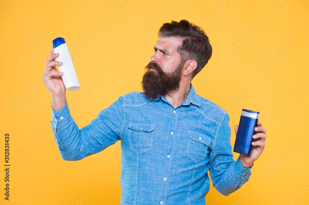 Treatment providing individual care. Hipster hold hair shampoo and conditioner yellow background. Hair treatment. Shampooing and conditioning. Beard treatment products. Skin treatment. Skincare Treatment providing individual care. Hipster hold hair shampoo and conditioner yellow background. Hair treatment. Shampooing and conditioning. Beard treatment products. Skin treatment. Skincare