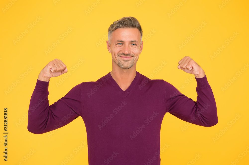 Confidence is best outfit. Confident man yellow background. Handsome guy flex arms. Confident look of fashion model. Fashion and style. Confident and strong. Developing confident power Confidence is best outfit. Confident man yellow background. Handsome guy flex arms. Confident look of fashion model. Fashion and style. Confident and strong. Developing confident power