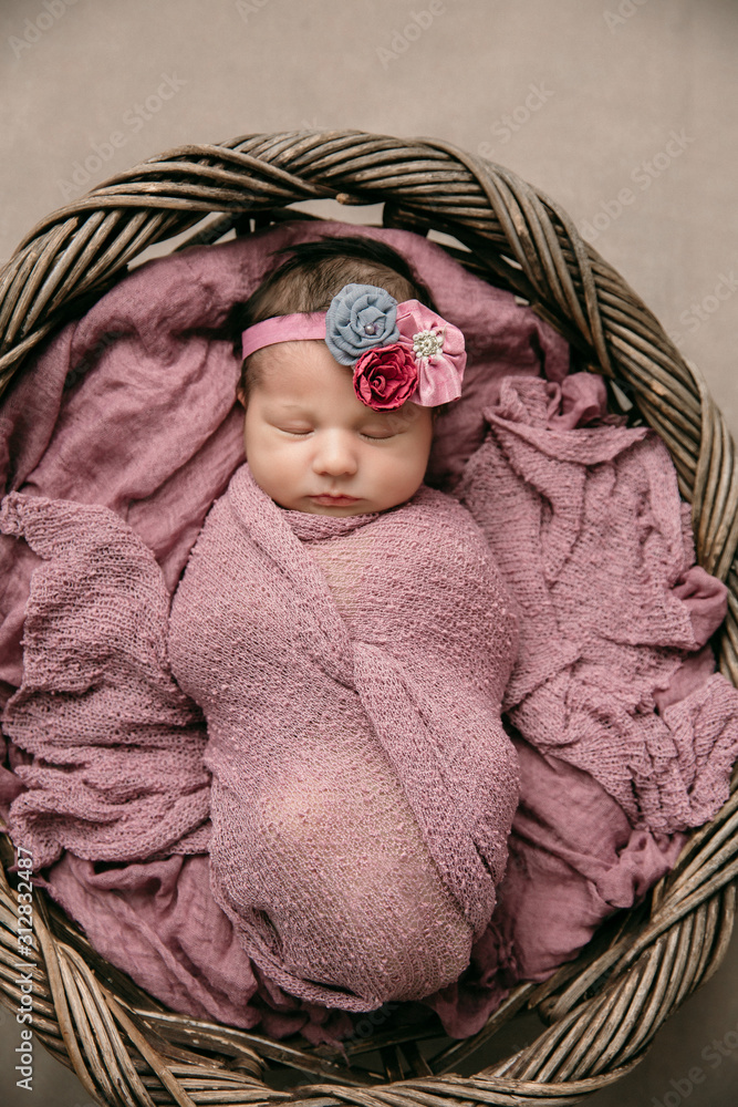 Baby Girl Wrapped Up In Newborn Blanket, New Born Kid Bundled Hat, One  Month On Carpet Stock Photo, Picture and Royalty Free Image. Image 44399180.
