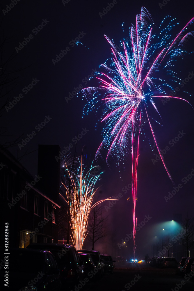 Beautiful fireworks and firecrackers lit right on the street in Netherlands