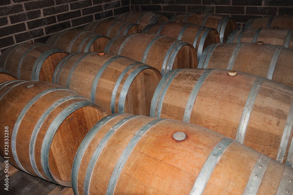 Wooden barrels for wine storage in a cellar