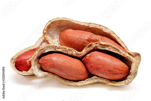 Large peeled peanuts close-up of beans in the shell isolated on white background . Unpeeled peanuts in the shell. Peanuts, for background or texture. Growing organic protein