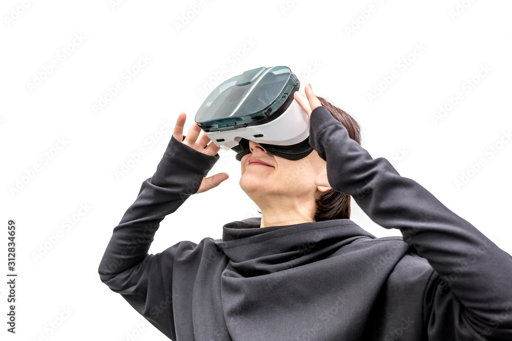 old woman in 360 view virtual reality headset playing the game isolated on white background. 3D device gadget for watching movies for travel and entertainment in 3d space.. Cardboard VR AR glasses old woman in 360 view virtual reality headset playing the game isolated on white background. 3D device gadget for watching movies for travel and entertainment in 3d space.. Cardboard VR AR glasses