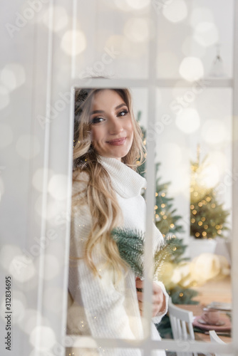 Cute tender girl in a warm white sweater. © farmuty