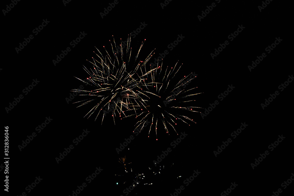 Ordinary fireworks, over the city, red and yellow Ordinary fireworks, over the city, red and yellow