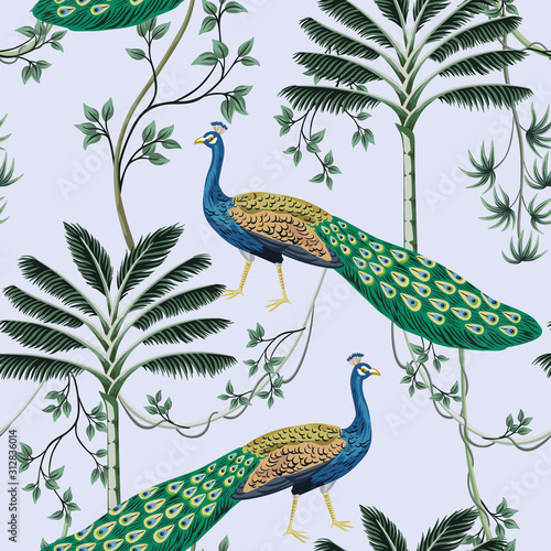 Tropical vintage peacock bird, palm tree and liana floral seamless pattern blue background. Exotic jungle wallpaper.