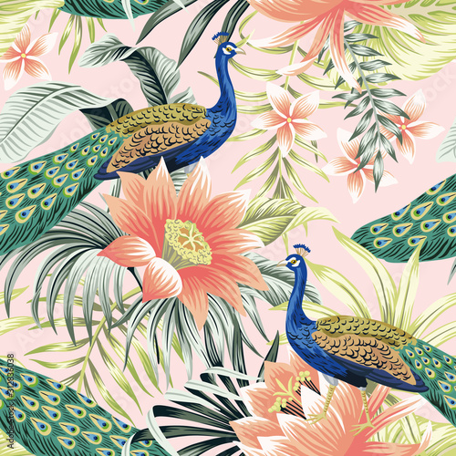Tropical vintage peacock bird, lotus flower, palm leaves floral seamless pattern pink background. Exotic jungle wallpaper.