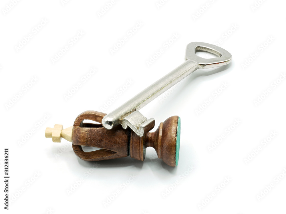 Key To The Revolution Concept: A Defeated King Chess Piece Lying Under A Key, Isolated On White Background Key To The Revolution Concept: A Defeated King Chess Piece Lying Under A Key, Isolated On White Background