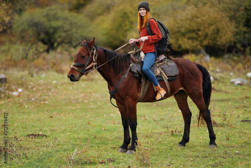 woman riding horse in field © SHOTPRIME STUDIO