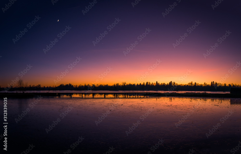 Colorful sky and colorful water in lake reflected in evening, panorama