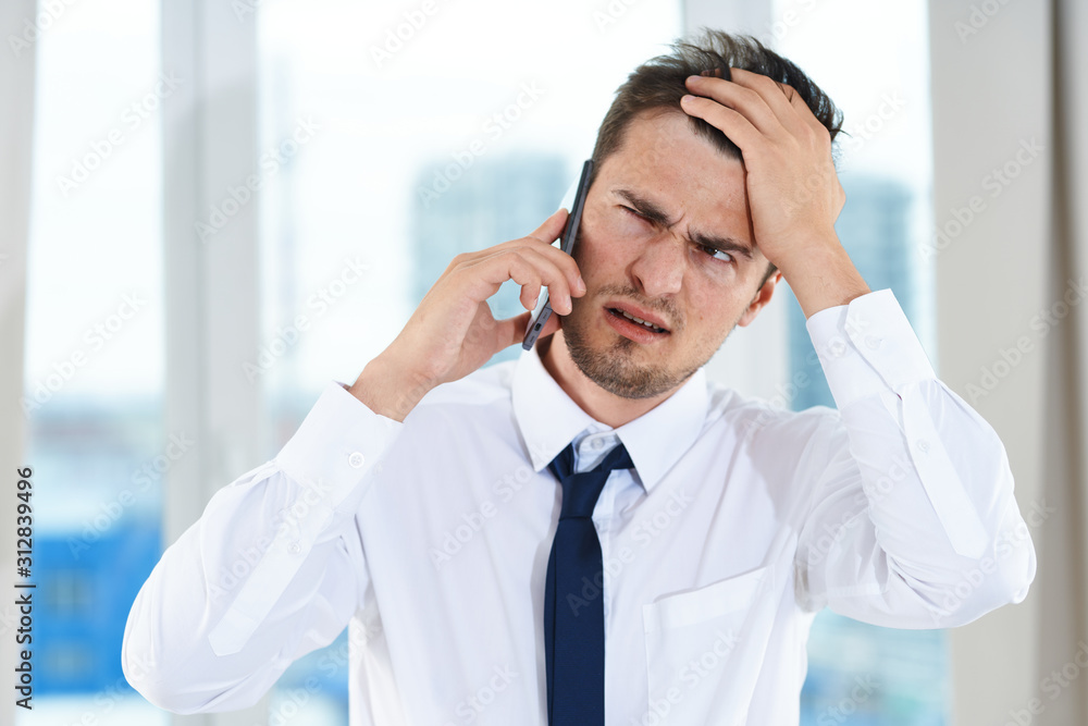 young businessman talking on the phone young businessman talking on the phone