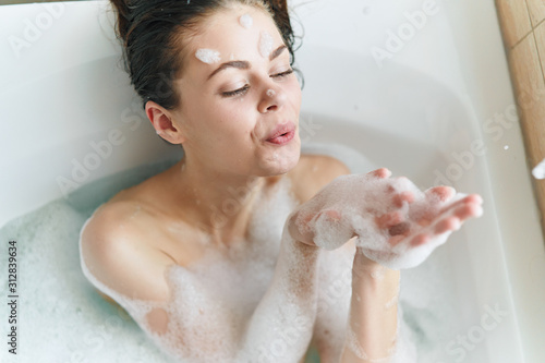 girl in bath with foam