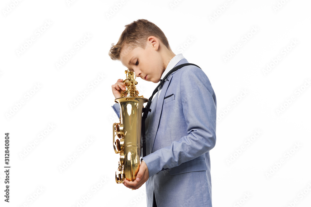 Fototapeta premium boy with saxophone