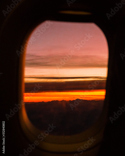 Wallpaper Mural sunset in airplane window in flight Torontodigital.ca