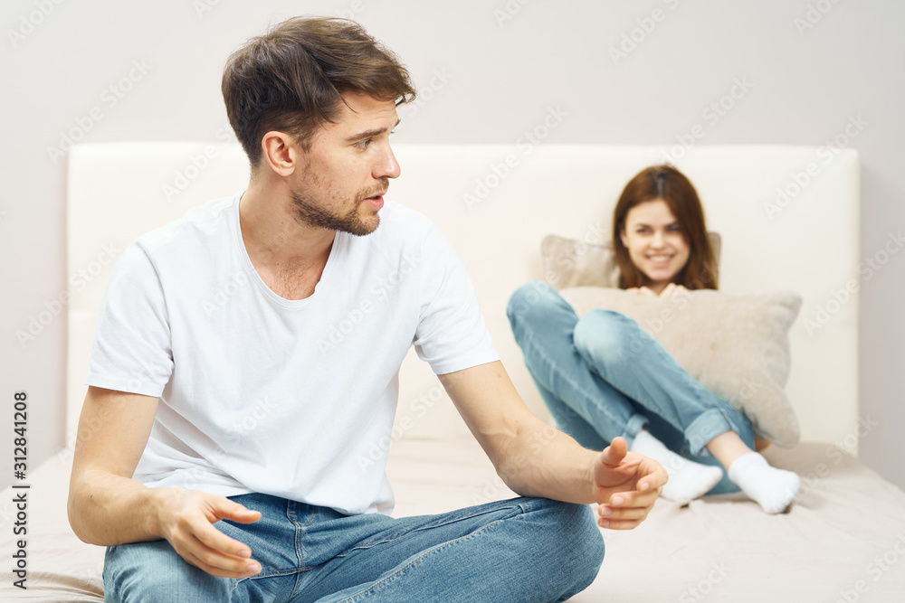 happy couple sitting on sofa watching tv happy couple sitting on sofa watching tv