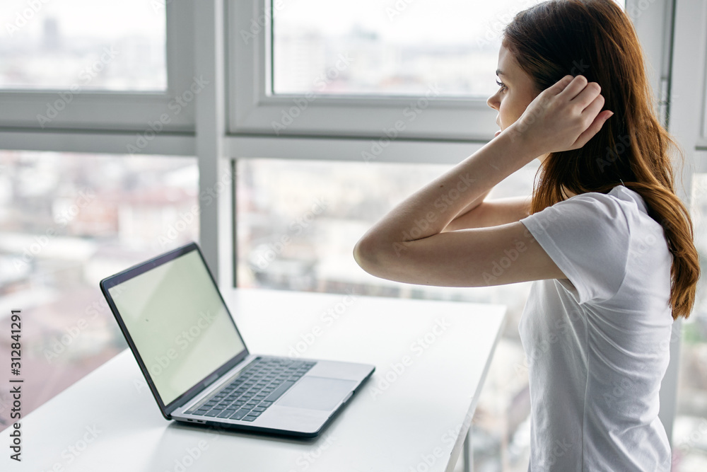 young woman working on laptop at home young woman working on laptop at home