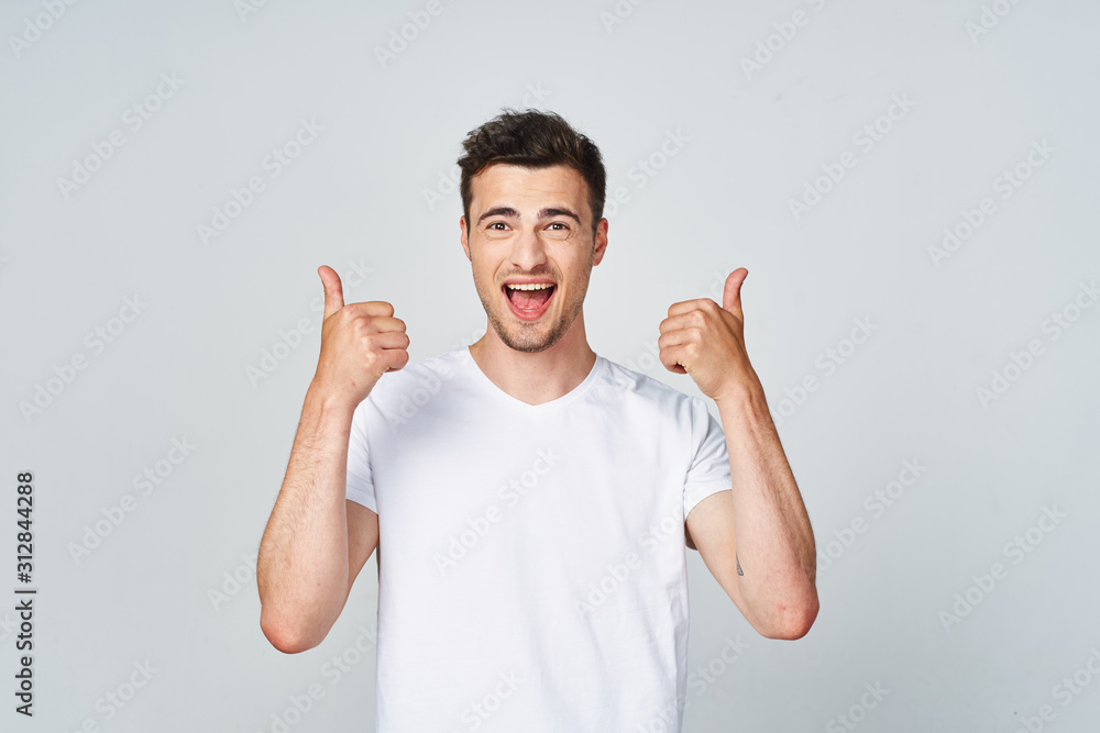 young man with arms raised young man with arms raised