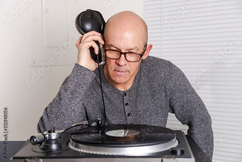 man  listens to records photo