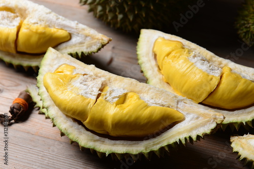 Durian riped and fresh ,durian peel with yellow colour on wooden table.