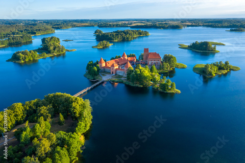 Blue lakes around old castle Trakai in Lithuania aerial view. View from above to Trakai castle photo