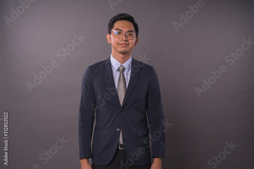 Portraiture of Young male intrepreneur or business man.Studio shot. photo