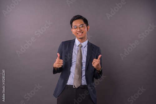 Happy young male intrepreneur or business man show 