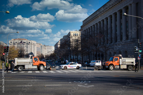 Grabage truck and police car blocking the street