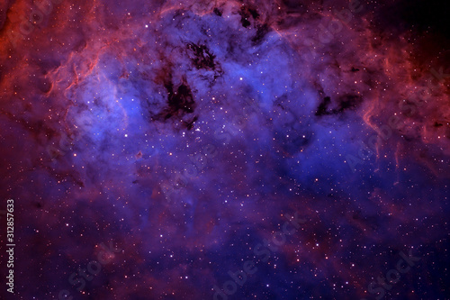 Beautiful deep space, in blue and red light, with stars. Elements of this image were furnished by NASA © Artsiom P