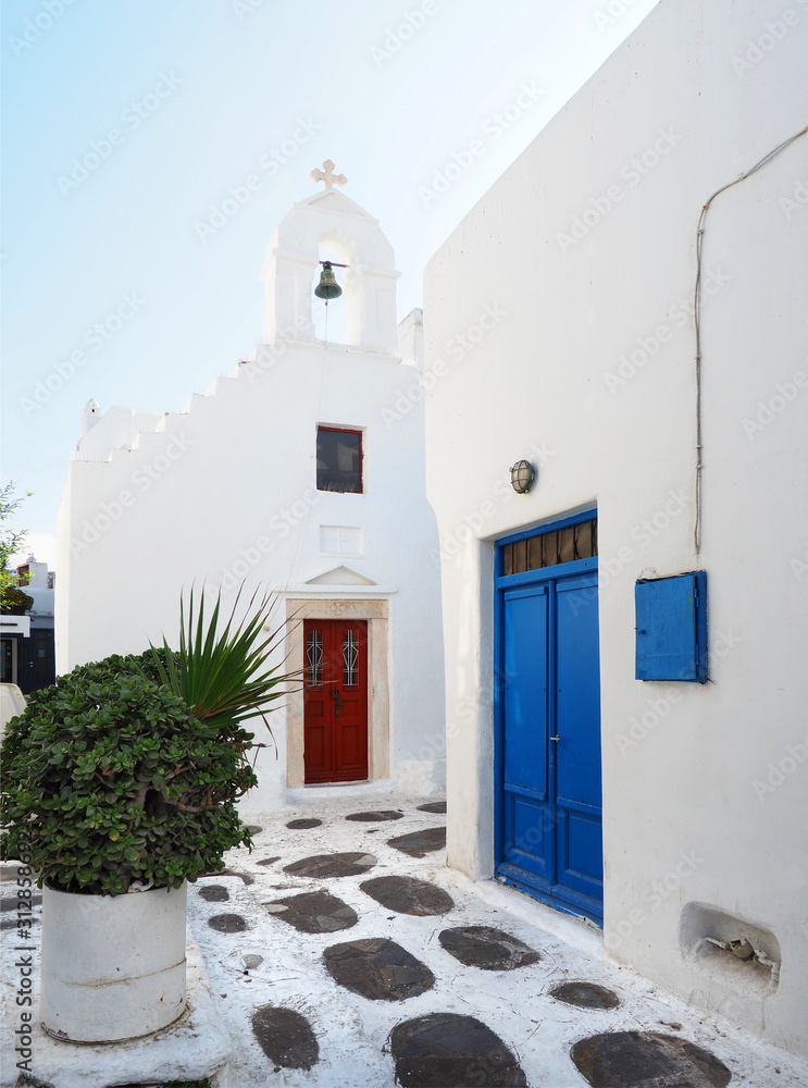 Typical Whitewashed Buildings with Colorful Doors and Accents of Mykonos, Greece