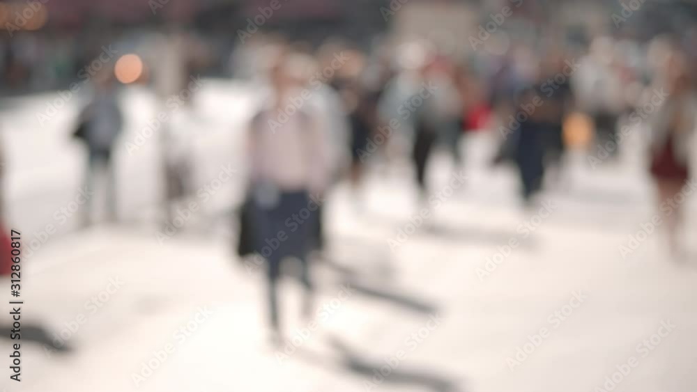 Slow motion video of New York City commuting crowd, blur, unrecognizable business people walking, sunny summer day Slow motion video of New York City commuting crowd, blur, unrecognizable business people walking, sunny summer day